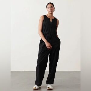 Athleta Black Flex Jumpsuit with zip and pockets size Small NWT